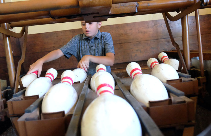 Photo of boy setting pins